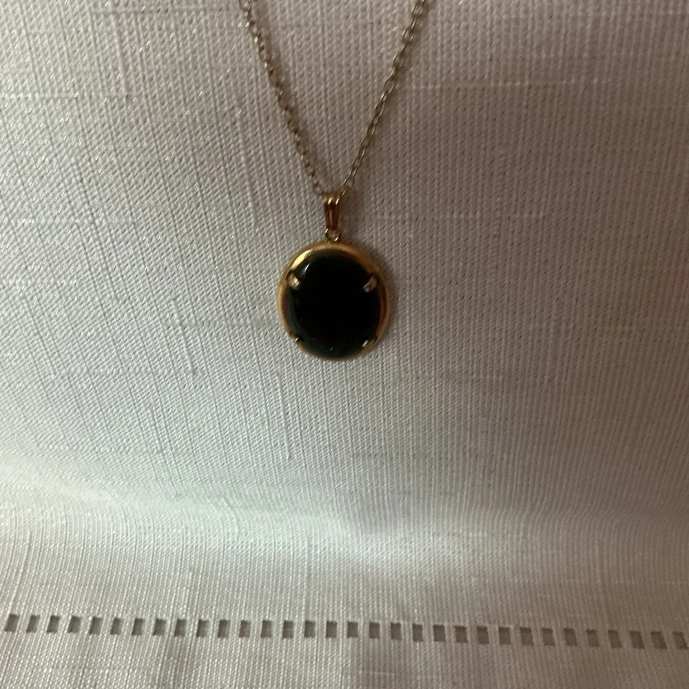 Black Oval Gold Tone Pendant Necklace